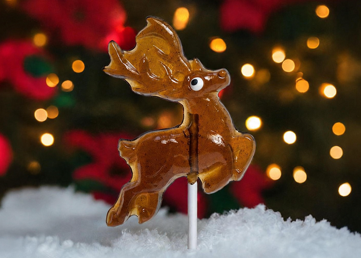 Assorted Christmas lollipops displayed on a festive holiday stand.